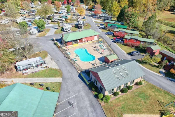an aerial view of a houses with outdoor space