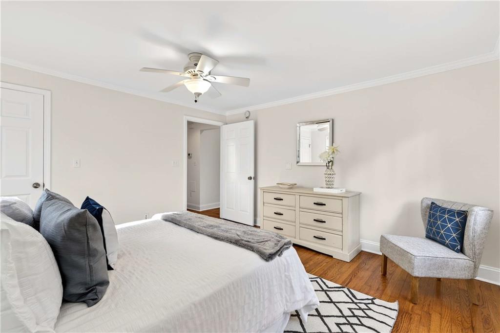 421 Emory Drive Northeast Atlanta, GA 30307 - Photo 23 of 42 a bedroom with a bed and ceiling fan