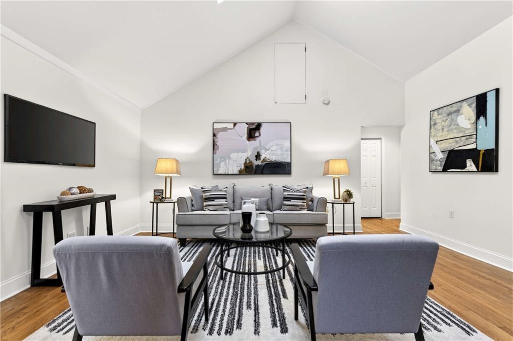 421 Emory Drive Northeast Atlanta, GA 30307 - Photo 6 of 42 a living room with furniture and a flat screen tv