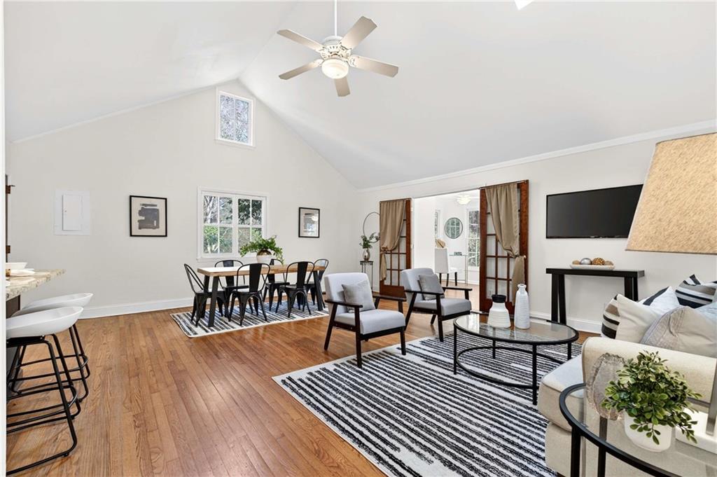 421 Emory Drive Northeast Atlanta, GA 30307 - Photo 8 of 42 a living room with furniture a fireplace and a table