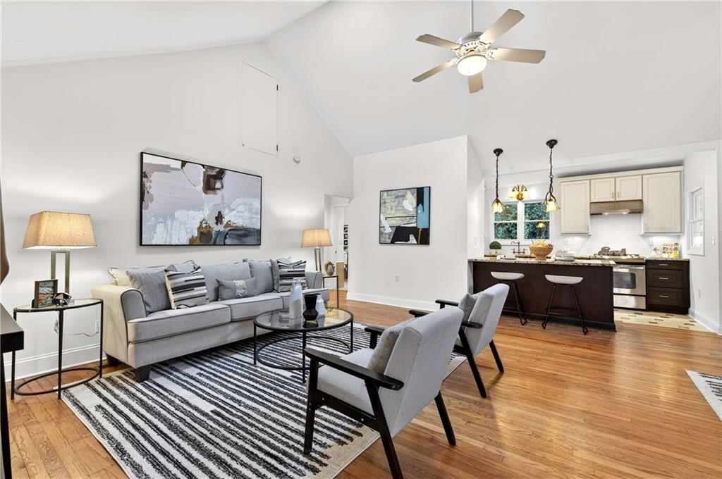 421 Emory Drive Northeast Atlanta, GA 30307 - Photo 10 of 42 a living room with furniture or couch and a chandelier