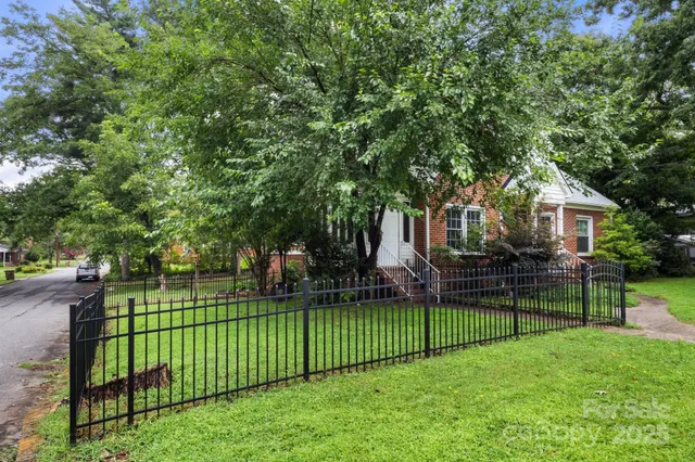 a view of a house and a yard
