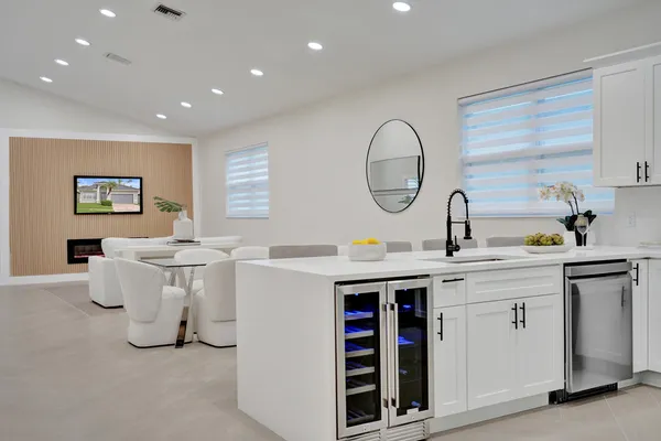 a large white bed in a white room