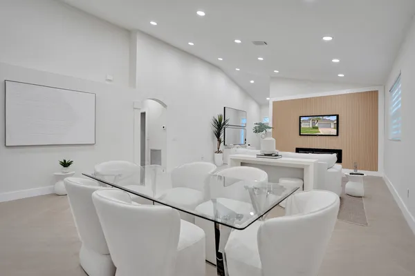 a kitchen with stainless steel appliances granite countertop a refrigerator and a stove top oven