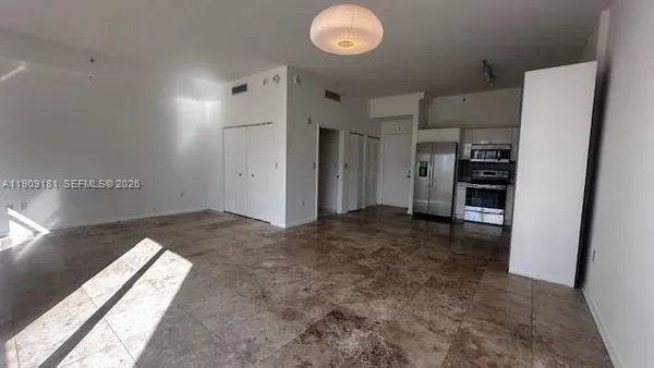 a stove top oven sitting inside of a kitchen