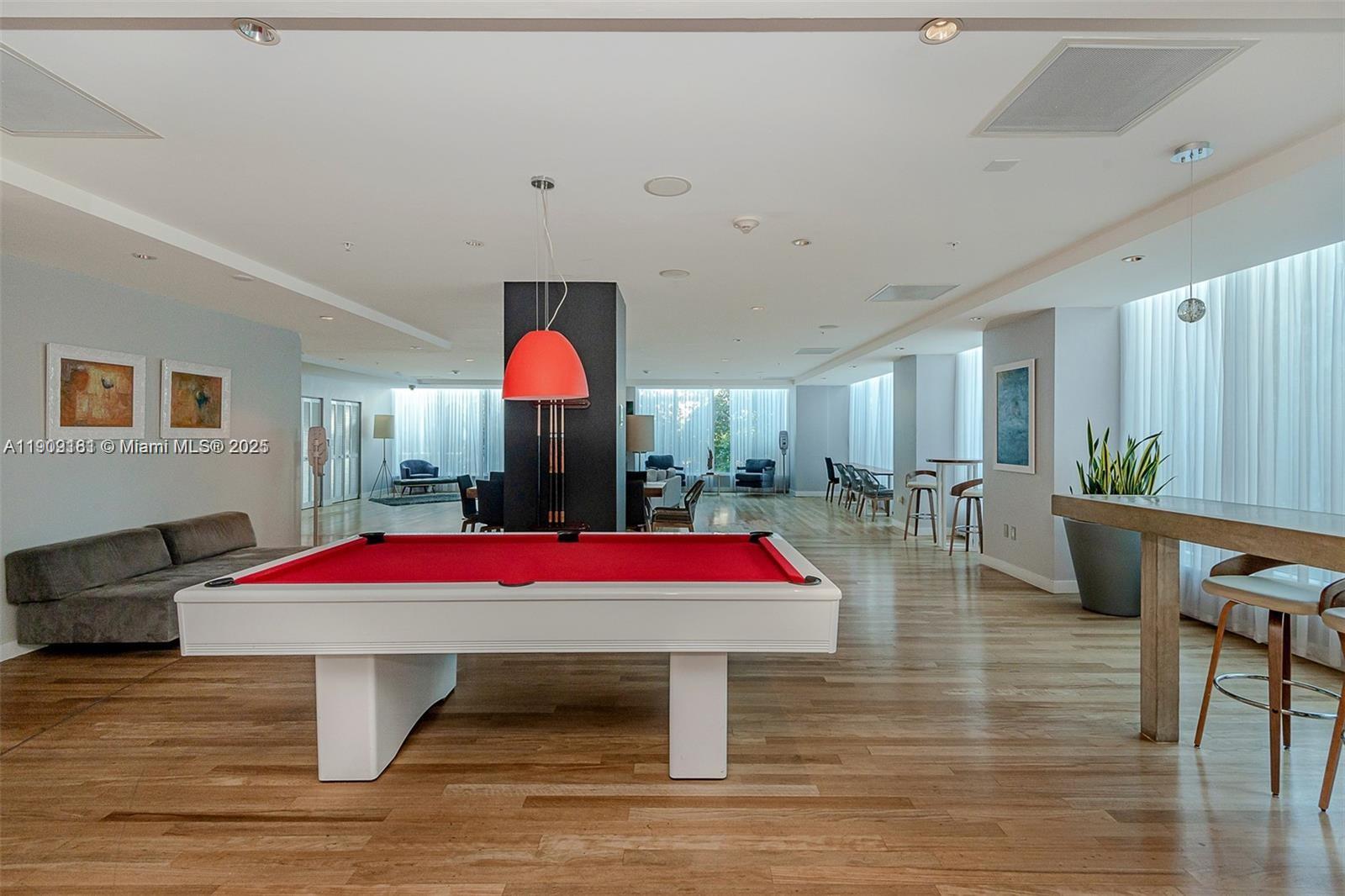 133 Northeast 2nd Avenue, Unit 617 Miami, FL 33132 - Photo 22 of 38 a room with pool table table soccer and windows