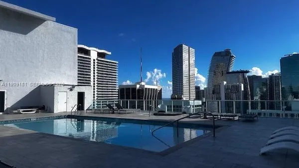 a view of roof deck with patio