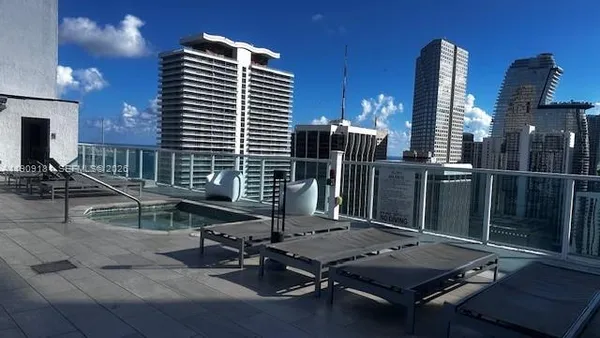 a view of a swimming pool with a roof deck
