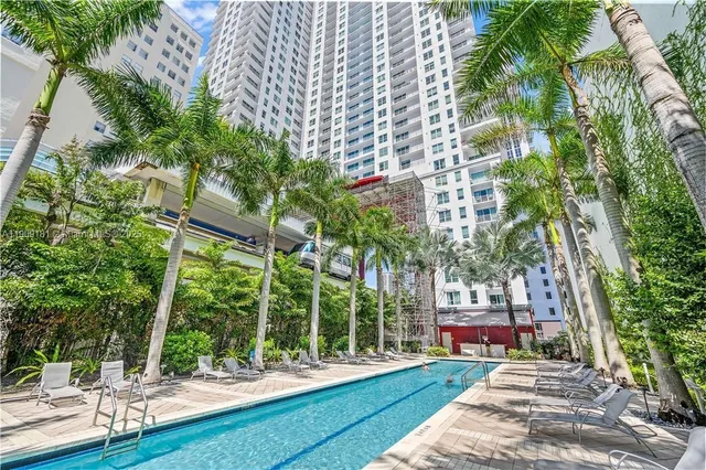 a lobby with furniture and a potted plant