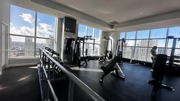 a view of a patio with a table and chairs