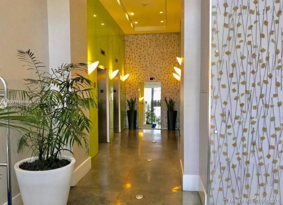 133 Northeast 2nd Avenue, Unit 617 Miami, FL 33132 - Photo 37 of 38 a lobby with furniture and a potted plant