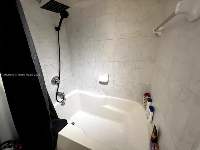 a living room with furniture and flat screen tv