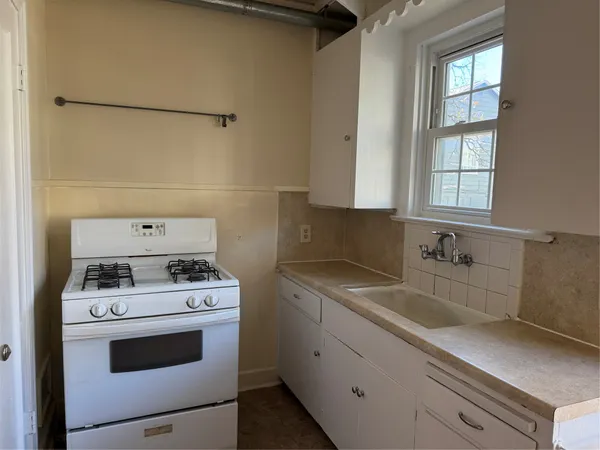 a kitchen with a stove and a sink