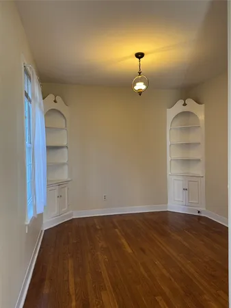 a view of a room with rack and wooden floor