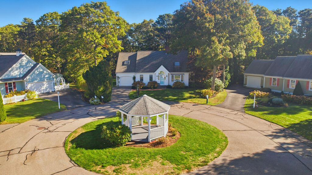 42 Eventide Lane Hyannis, MA 02601 - Photo 28 of 39 a view of a house with outdoor space and sitting area