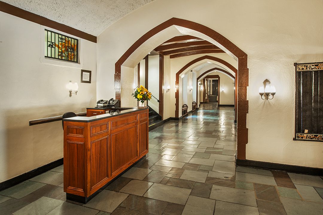 a view of a hallway with entryway and furniture
