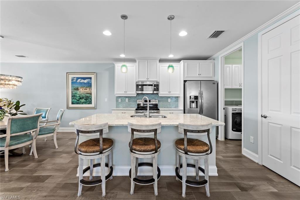 14904 Edgewater Circle Naples, FL 34114 - Photo 10 of 50 a view of a dining room kitchen and a window
