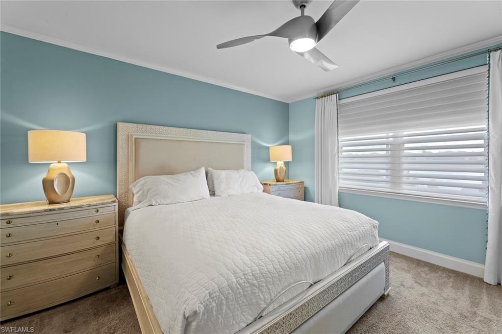14904 Edgewater Circle Naples, FL 34114 - Photo 17 of 50 a bedroom with a bed and a window
