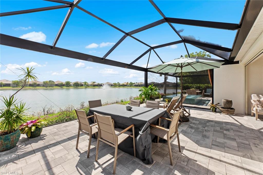 14904 Edgewater Circle Naples, FL 34114 - Photo 2 of 50 a patio with a table and chairs