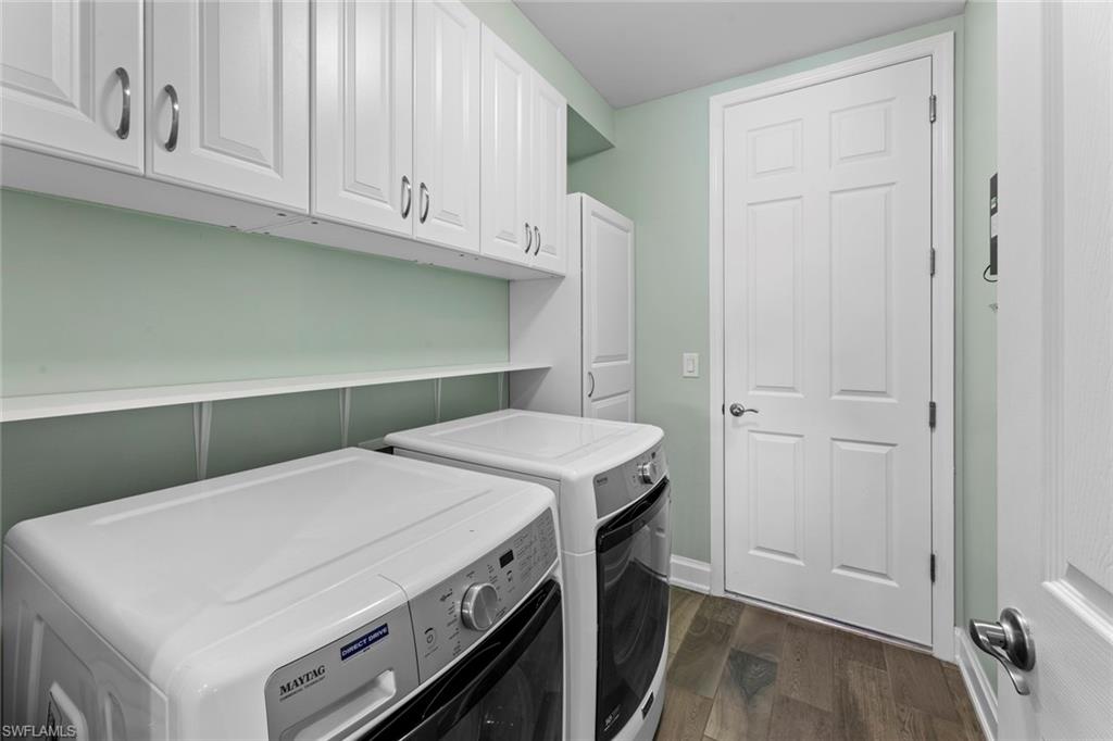 14904 Edgewater Circle Naples, FL 34114 - Photo 25 of 50 a utility room with dryer and washer