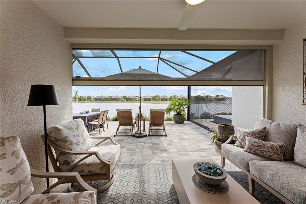 14904 Edgewater Circle Naples, FL 34114 - Photo 28 of 50 a living room with furniture and a large window