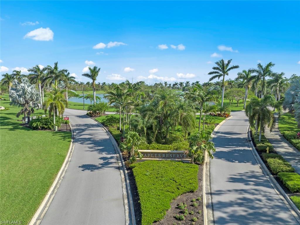 14904 Edgewater Circle Naples, FL 34114 - Photo 35 of 50 a view of a yard with flower plants