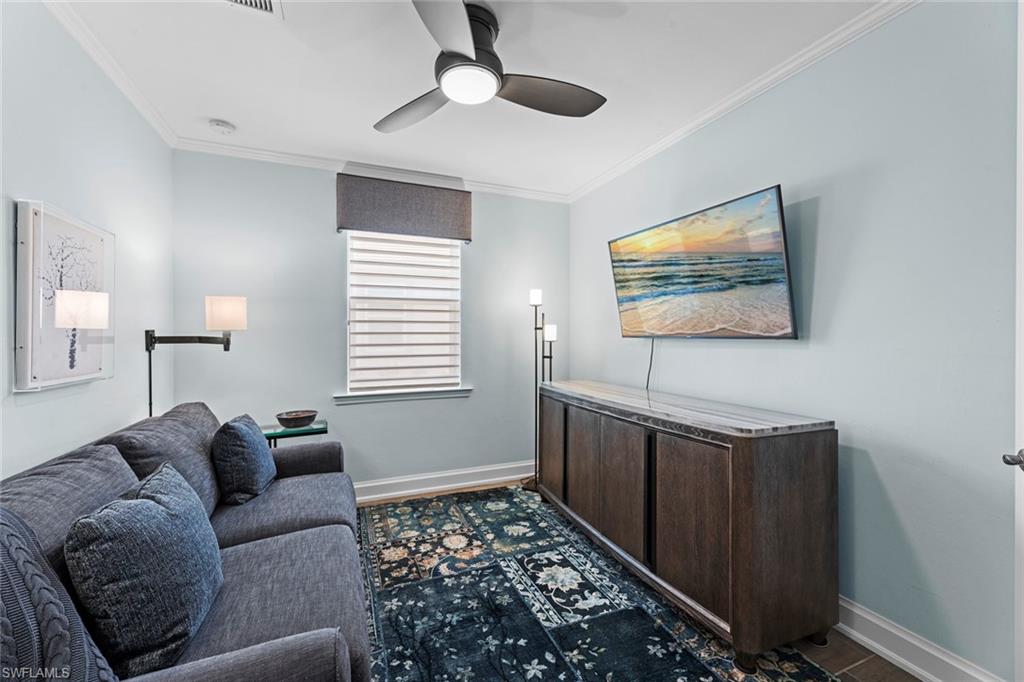 14904 Edgewater Circle Naples, FL 34114 - Photo 8 of 50 a living room with furniture and a rug