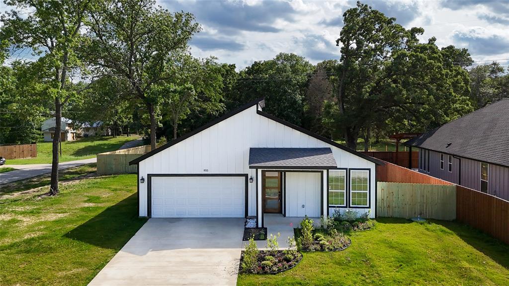 855 Kontiki Tool, TX 75143 - Photo 1 of 1 View of front of home featuring concrete driveway, a garage, and a shingled roof