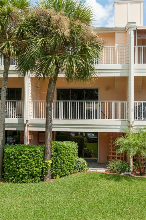 525 Sandy Hook Road Treasure Island, FL 33706 - Photo 1 of 1 a front view of a house with a garden