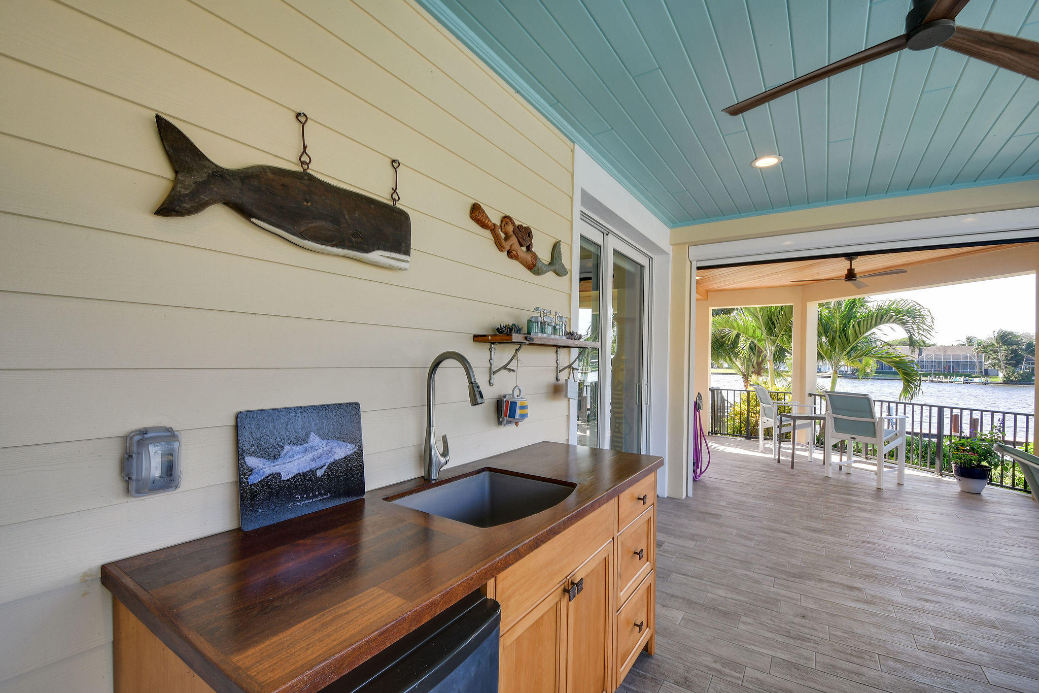 4980 County Line Road Tequesta, FL 33469 - Photo 31 of 56 Custom cabinet v/mini fridge and sink
