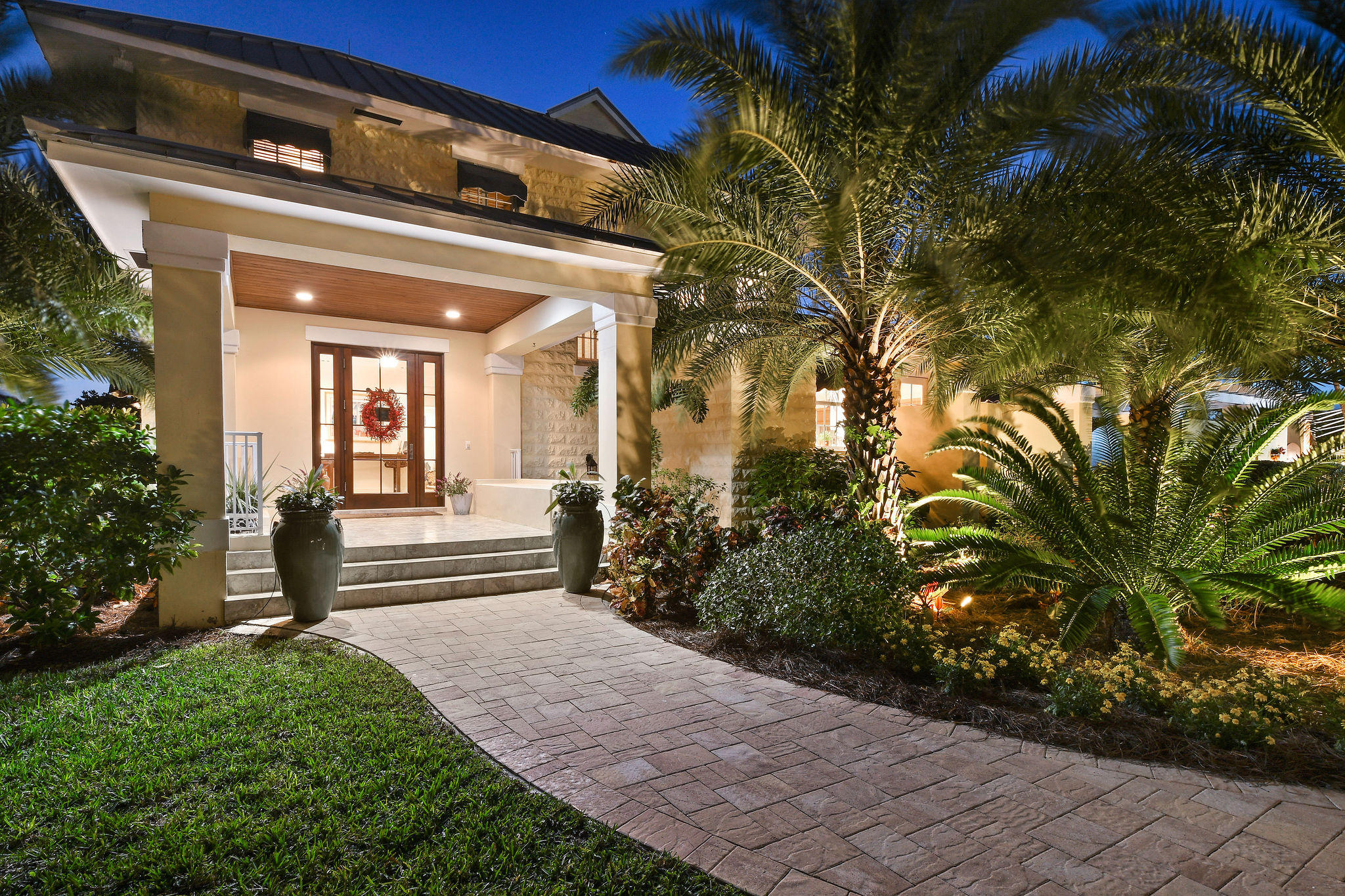 4980 County Line Road Tequesta, FL 33469 - Photo 55 of 56 elegant evening entrance