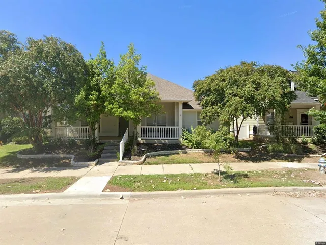 a view of a house with a street