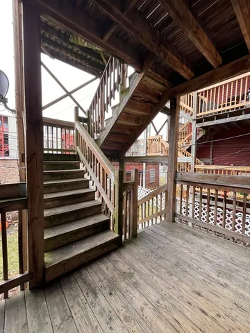a view of porch with deck and wooden floor
