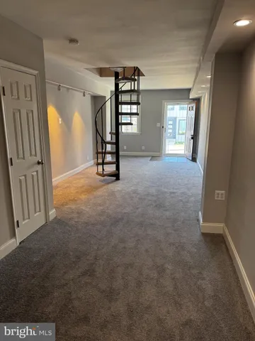 en view interior of a house with wooden floor and windows