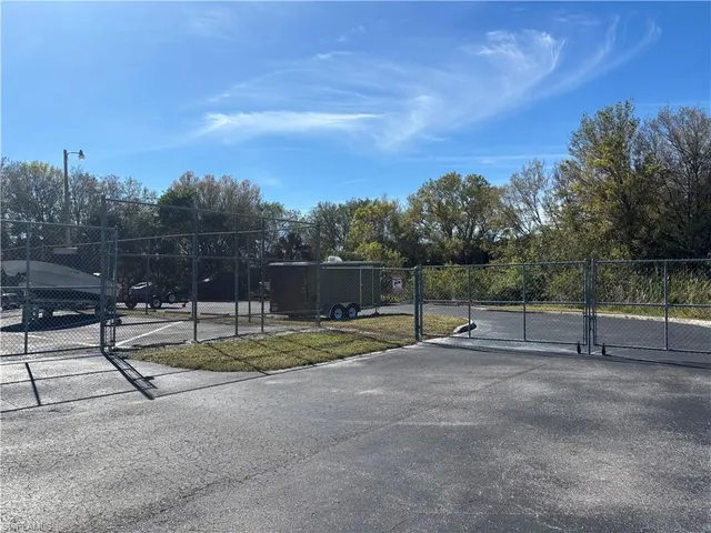 a view of backyard with trampoline
