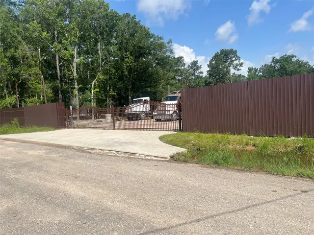 a view of backyard with outdoor seating and green space