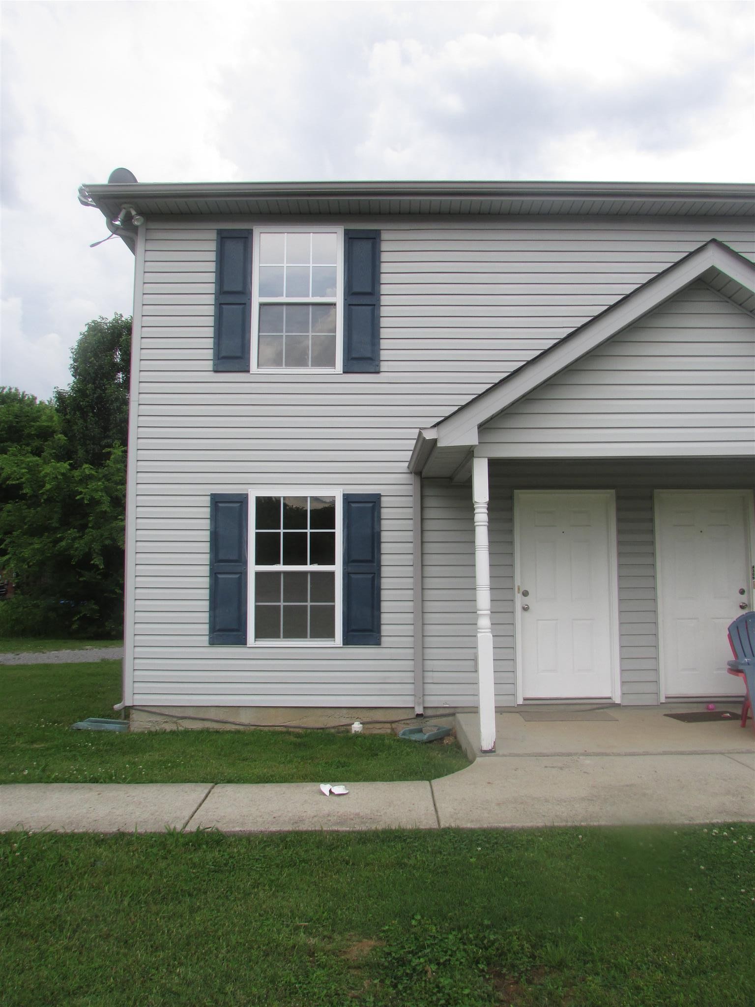 4311 Cap Davis Court Murfreesboro, TN 37129 - Photo 1 of 14 a front view of a house with a garden