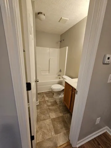 a bathroom with a sink and a toilet