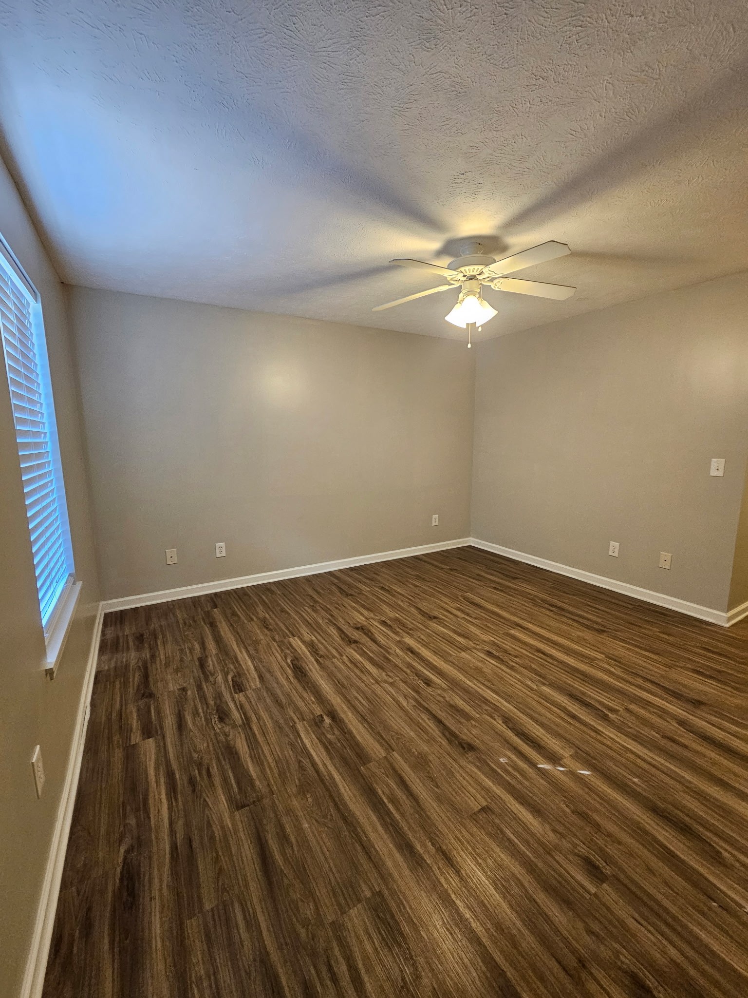 4311 Cap Davis Court Murfreesboro, TN 37129 - Photo 13 of 14 en empty room with wooden floor and fan