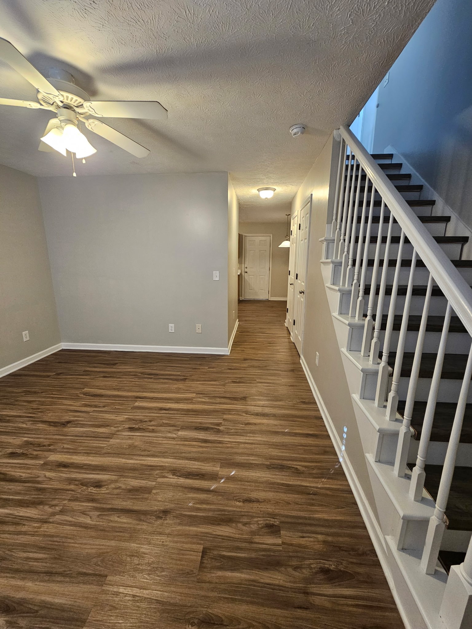 4311 Cap Davis Court Murfreesboro, TN 37129 - Photo 5 of 14 a view of an empty room with wooden floor and staircase