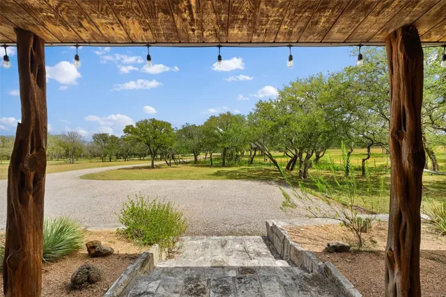 a kitchen with stainless steel appliances a stove a sink dishwasher and a refrigerator