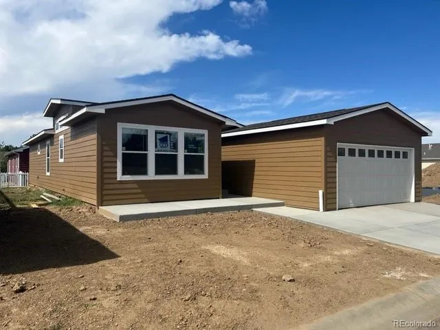a front view of a house with a garage