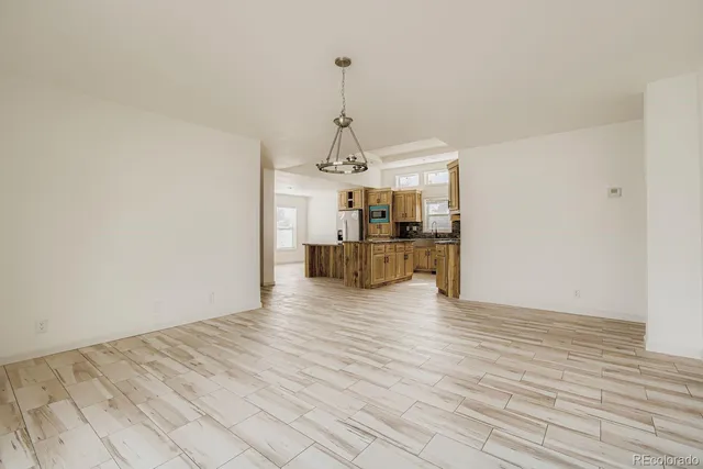 a view of a kitchen from the hallway