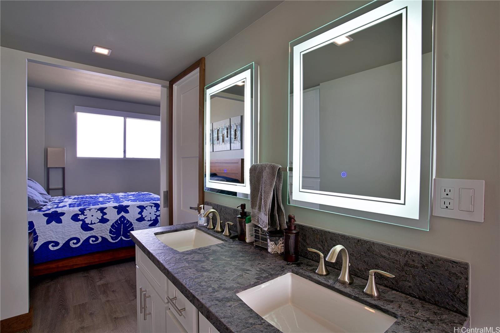 2211 Ala Wai Boulevard, Unit P6 Honolulu, HI 96815 - Photo 11 of 24 a bathroom with a granite countertop sink and a mirror