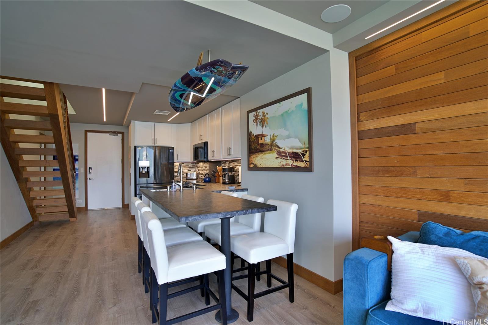 2211 Ala Wai Boulevard, Unit P6 Honolulu, HI 96815 - Photo 7 of 24 a view of a dining room with furniture and wooden floor