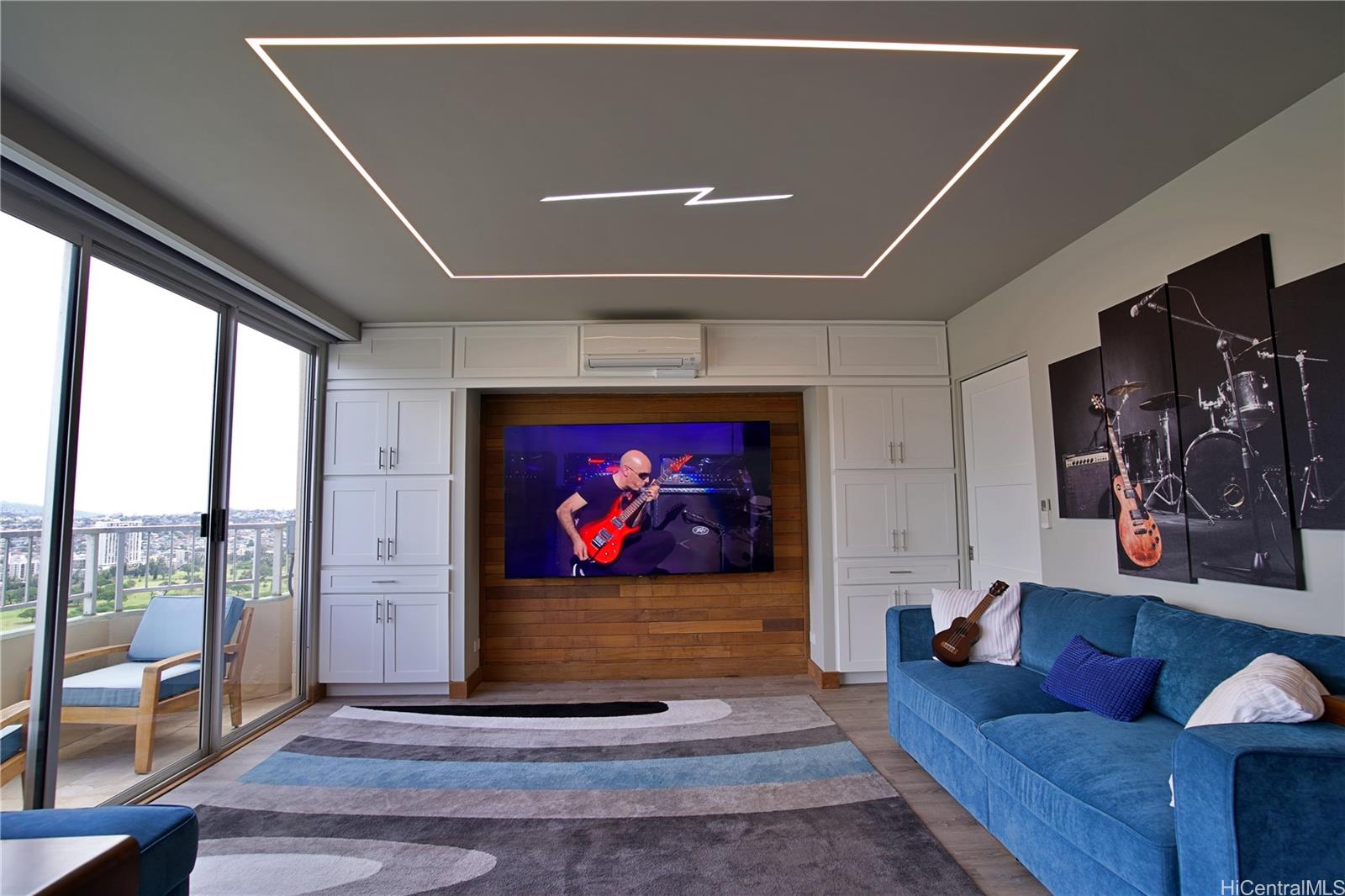 2211 Ala Wai Boulevard, Unit P6 Honolulu, HI 96815 - Photo 8 of 24 a living room with furniture a rug and a floor to ceiling window