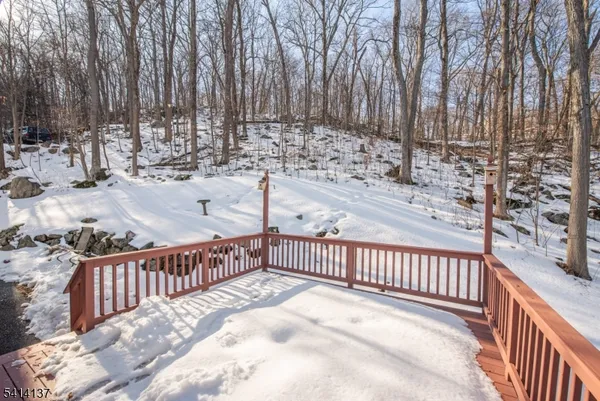 a view of a backyard with wooden fence