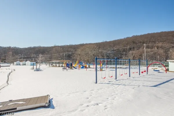 a view of mountain with wooden fence
