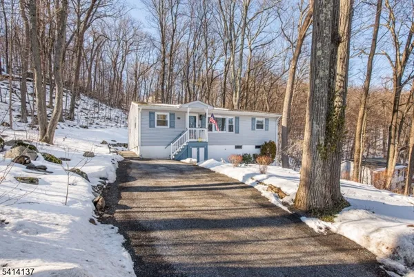 a view of house with outdoor space and sitting space
