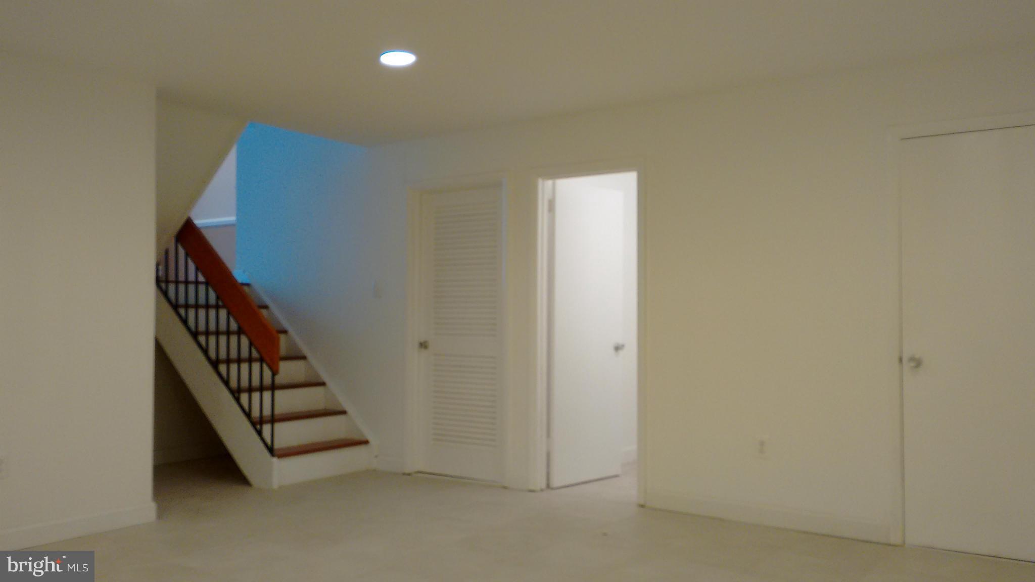 11655 Newbridge Court Reston, VA 20191 - Photo 16 of 30 a view of a hallway with staircase